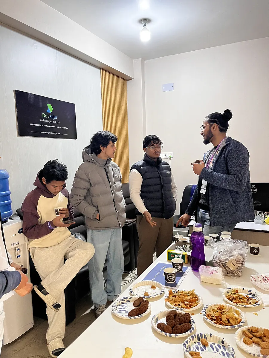 Think Purple Nepal: designers talking around the food table at Purple Circle Version 2